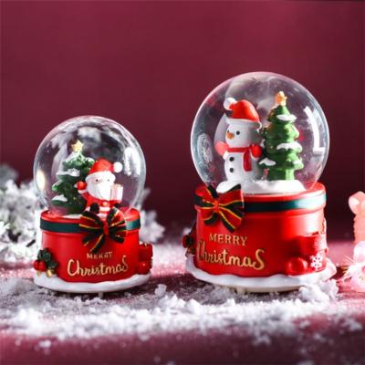 China 100% Handmade Resin Crafts Music Snowman Crystal Ball Music Box Christmas Decoration Creative Birthday Gift for sale