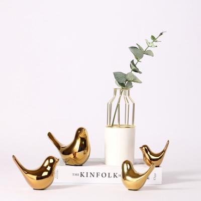 China Modern Simple Modern Design Ceramic Souvenir Bird Table Gold Gold Creative Home Decor for sale