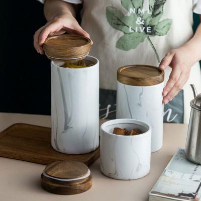 China Retro Creative Sealed Bottle Storage Nordic Ceramic Canister Kitchen Grain Storage Tea Canister for sale