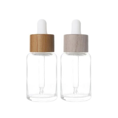 China 30ml 1oz Viable Custom Wooden Bamboo Lid Dropper Bottle Serum Tinctures Essential Oil Vial Glass Droplet Testing Clear Bottle for sale