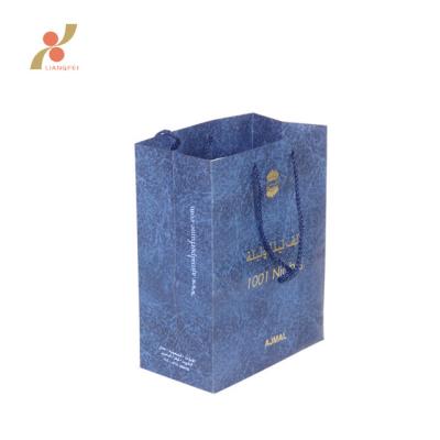 China Recyclable Wholesale Custom Printed Blue Cardboard Paper Gift Bag for sale