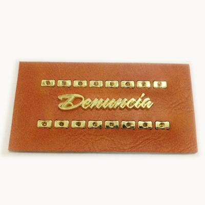 China Customized Viable Embossed Faux Leather Label With Metal For Jeans for sale