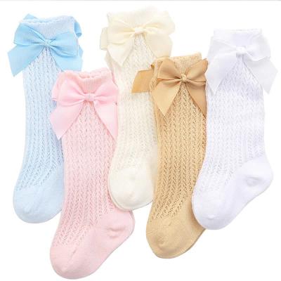 China DL-0507 Children's Socks Cotton Sporty Solid Color Knee High Baby Socks With Bow for sale