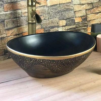 China F-028 Modern High Quality Bathroom Cement Sink Black Gold Painted Round Ceramic Art Wash Basin for sale