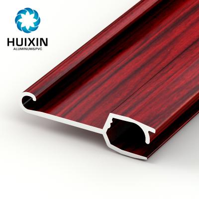 China Modern Material Aluminum Alloy Roller Shutter Door Parts Profile With Red Wood Grain for sale