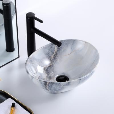 Chine Modern Unique Modern Oval Bathroom Sink Basin Art Dining Table Top Art Ceramic Marble Hand Basin à vendre