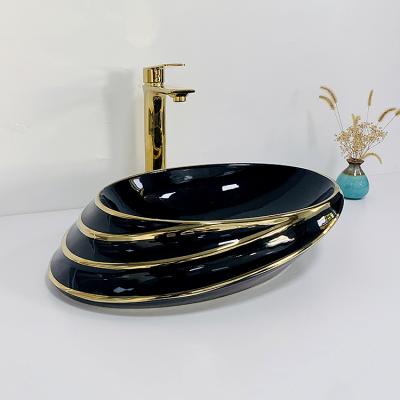 China Modern Sanitary Oval Luxury Oval Hand Basin Luxury Gold Oval Hand Basin Bathroom Decor Hotel Bathroom Decor Hotel Bathroom Sink Black Color Countertops for sale