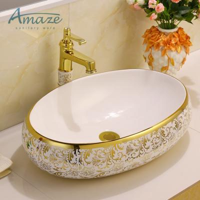 China Oval Shape Golden Sanitary Bathroom Manufacturer Wash Basin Ware Luxury Ceramic Wash Basin for sale