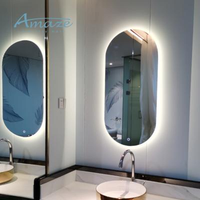 China Waterproof Wall Mounted Anti Fog Touch Switch Screen Magnifying Oval Vanity Led Smart Mirror With Led Lights For Hotel Home Bathroom for sale