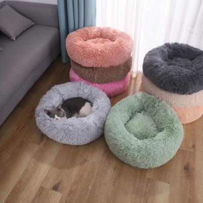 China 2021 Travel Long Soft Fluffy Plush Around Warm Donut Cat Nest Dog Sofa Soothing Cute Pet Bed Covering for sale