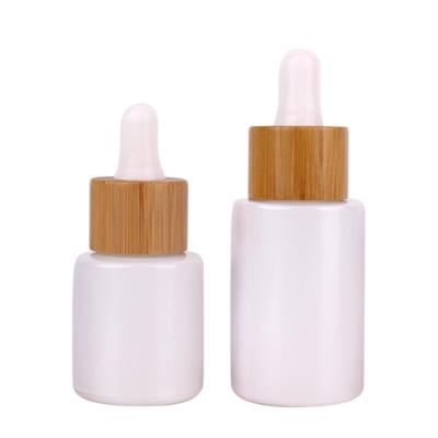 China Custom Bamboo Glass Cap Personal Care 40ml Essential Oil Glass Dropper Cosmetic Bottles for sale