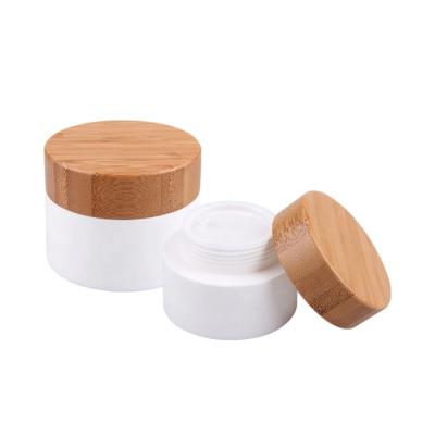 China Hot Selling Personal Care Eco-Friendly Wooden Lid 50G Bamboo Cosmetic Cream Acrylic Jar With Bamboo Lid for sale