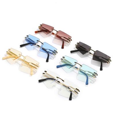 China 2022 New High Quality Women's Cat Eye Frameless Sunglasses Fashion Metal Design Brand Style Sunglasses for sale