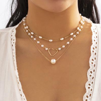 China Double-Layer Full Rhinestone Pearl Necklace Other Hollow Personality Women Small Love Heart Pendant Necklace Clavicle Chain for sale