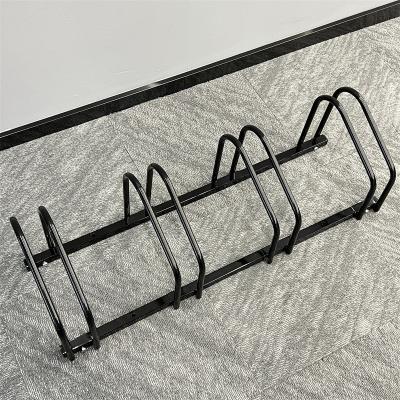 China Carbon Steel Compact 2 Capacity Organizer Cycling Floor Ground Mount Ribbon Adjustable Bicycle Racks Bike Parking Rack Garage Storage for sale