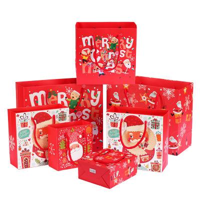 China Recyclable Stock Cheap Shopping Bag Merry Christmas Paper Gift Bag for sale