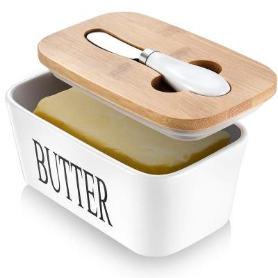 China Sustainable Porcelain Butter Dish With Bamboo Lid Covered Knife Airtight Butter Container 650 Ml for sale