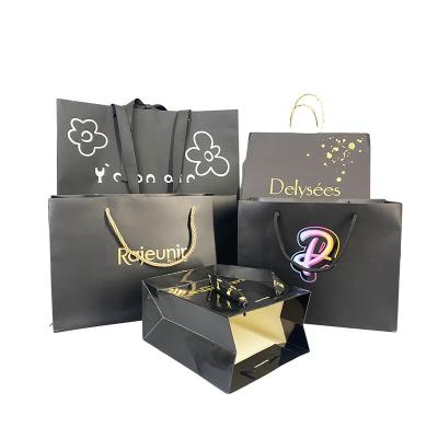 China Recycled Materials Wholesale Gift Paper Bag Cardboard Packaging Luxury Custom Clean Logo Black Matte Kraft Boutique Shopping Paper Bags With Handle for sale