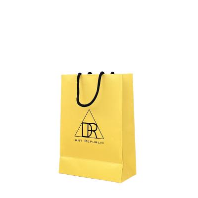 China Recycled Materials Personalized Elegant Brown Paper Wholesale Gift Bags Shopping Matte Custom Gift Bags With Retail Logo for sale