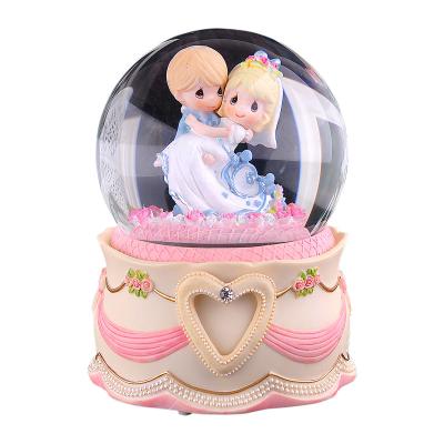 China Crystal Ball Merge With Music Box Gift For Girlfriend Or Wife Resin Wedding Sculpture With Photo View Wedding Theme Water Snow Globe Music Box for sale