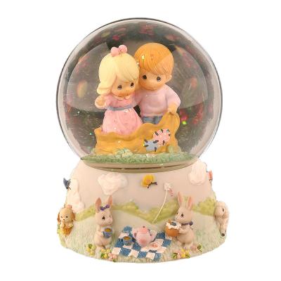 China Wholesale Custom Europe Factory Souvenirs Resin Cartoon Children Snow Globe Table Top Figurine Music Box For Gift for sale