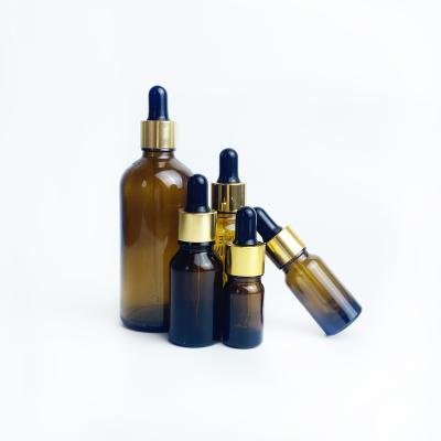 China Cosmetic Printing Logo On Amber Glass Bottle 30ml Dropper Bottles Essential Oil Bottle With Gold Black Cap for sale