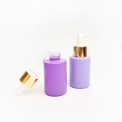 China Cosmetic in stock cosmetic 30ml flat shoulder frosted purple pink green blue color glass dropper bottle for serum essential oil for sale