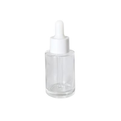 China Shoulder 30ml Round Essential Oil Serum Bottle Custom Flat Clear Glass Cosmetic Bottle With Dropper for sale