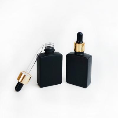 China 15ml 30ml 50ml Square Cosmetic Matte / Frosted Black Rectangle Glass Oil Dropper Bottles For Essential Oil for sale