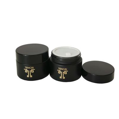 China Custom Cosmetic 15g 30g 50g Luxury Custom Matte Frosted Black Round Glass Cosmetic Jar With Logo For Cream for sale