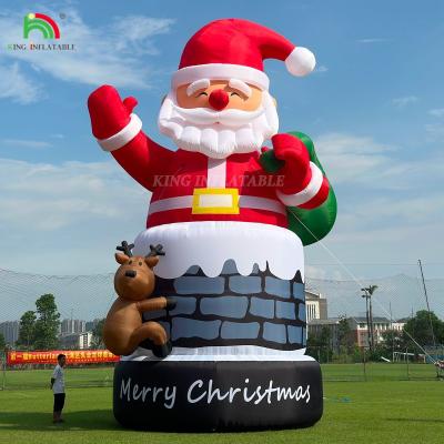 China 20FT 26ft 33ft Inflatable Santa Claus in Chimney with Reindeer Outdoor Christmas Decoration Blow Up Santa Claus for sale