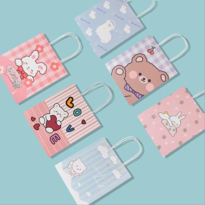 China Recyclable Cute Cartoon Printed Gift Handbag Shopping Storage Paper Bags for sale