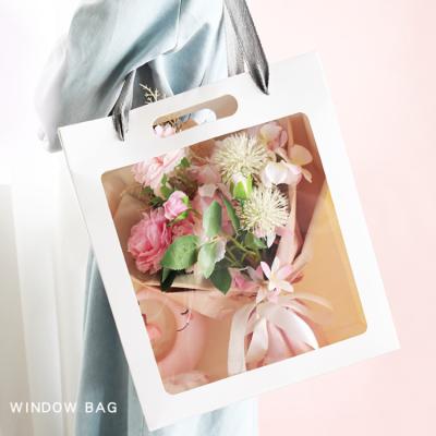 China Recyclable Custom Paper Tote Gift Packaging Bags Doll Bag Flower Bag With Window for sale