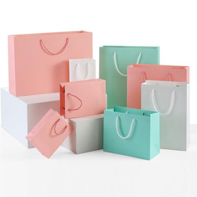 China Universal Gift Recyclable Clothing Food Paper Bag Handbag for sale