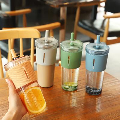 China Simple Minimalist 710ml Silicone Plastic Kids Juice Milk Drink Cup Cute Stirring Water Bottle With Straw Lid for sale