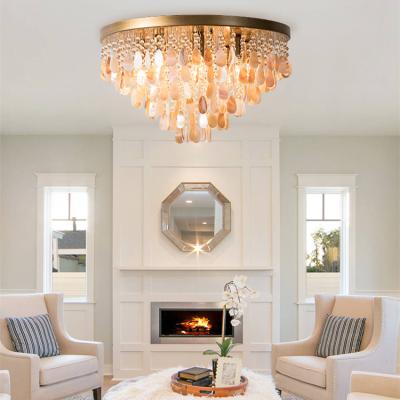 China Hot Selling Modern Simple Bedroom Living Room Pendant Light Fixture Round Shell Chandelier Crystal Ceiling Lamp for sale