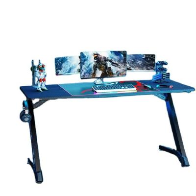 China Younger Adjustable Electronic Competition Design Z Shape Leg Desk (Height) With Blue Carbon Fiber LED Lights Gaming Desk for sale