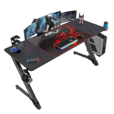 China Younger Design Adjustable E-sports Equipment Extra Large (Height) Carbon Fiber Texture Top Professional Gaming Desk with RGB LED Lighting Effects for sale