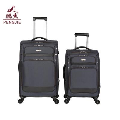 China Luxury Cotton Fabric China Luggage Factory Wholesale 4 Wheels Spinner Luggage for sale