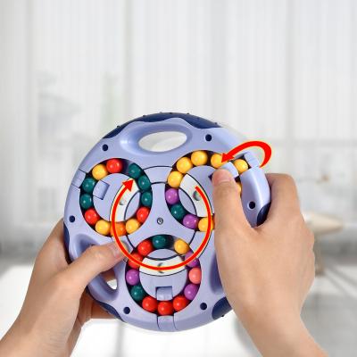 China Develop Fingertip Bean Fidget Toys Educational Kids Intelligence Magic Relaxing Brain Game Spin Puzzle Cube For Kids for sale