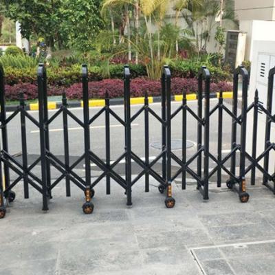 China Manual push and pull Folding Security Barrier Black Standing Sliding Gate Road Accordion Barrier Manual Metal Retractable Fence for sale