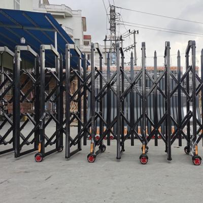 China Manual push and pull Black Standing Sliding Gate Road Accordion Barrier Metal Manual Folding Gate Security Barrier Retractable Fence for sale