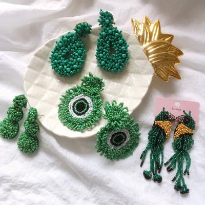 China 2023 FASHIONABLE Popular Fringed Green Handmade Rice Long Pearl Earrings Geometric Easter Earrings Creative Dangle Earrings For Women for sale