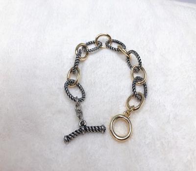 China New Hiphop Charms Jewelry Silver And Gold Intertwined Spiral Shape Bracelet for sale