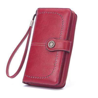 China Korean style large-capacity mobile phone bag women's long wallet female newcomer retro skin wax oil hollow border wallet for sale