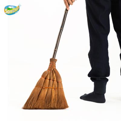 China Best price long handle indoor and outdoor dust cleaning wooden handle coconut stiffen bed brooms wholesale for sale