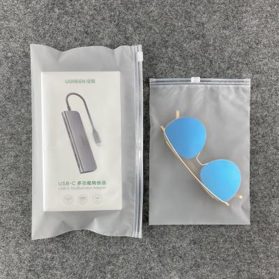 China Recyclable Small Things T Shirt Swimwear Frosted Zipper Plastic Packaging Bags For Clothes Waterproof Material for sale