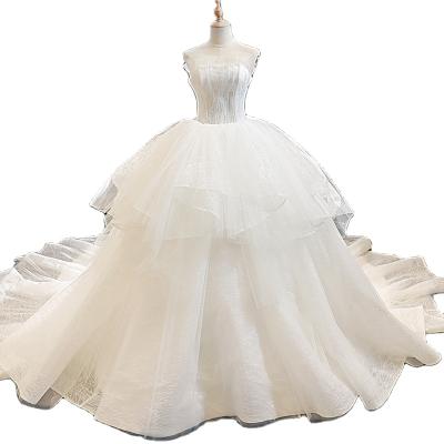 China Custom Made Layered Strapless Pompous Wedding Dresses Dry Cleaning Gauze Skirt Wedding Dress Bridal Gowns for sale