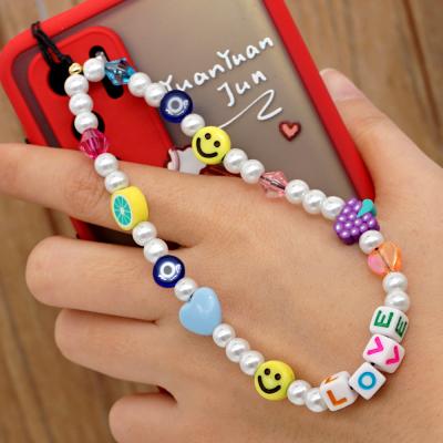 China Custom Cute Colorful Smile Face Amazon Girls Phone Stand Chain Bead Women Letter Wallet DIY Ladies Fashion Mobile Chain for sale