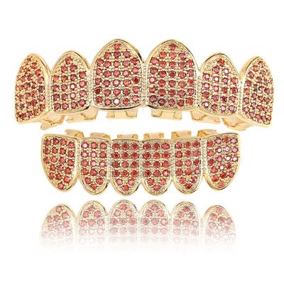 China Hot Selling Hip Hop Gold Brass Real Teeth Gold Plating Zircon Grillz Gold Plating Zircon Grillz Vampire Teeth Trends Micro Inlaid Decorative Braces for sale